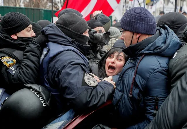 Ukrainian small businessmen clash with police during a rally with the slogan Save FOP (individual-entrepreneurs) as they try to set up a tent camp on the Independence square in Kiev, Ukraine, 15 December 2020, amid the ongoing coronavirus COVID-19 pandemic. Small businessmen protested against strict quarantine announced by the Government between 08 and 24 January 2021 and demand the abrogation of the amendments to a law about the simplified tax system, which will considerably complicate their ability to manage their businesses, raise their prices for clients and increase the possibility of unjustified fines, according to local media reports. (Photo by Sergey Dolzhenko/EPA/EFE)