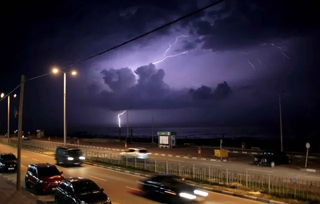 Lightning strikes on the beach of Gaza City, Wednesday, October 28, 2015. (Photo by Khalil Hamra/AP Photo)