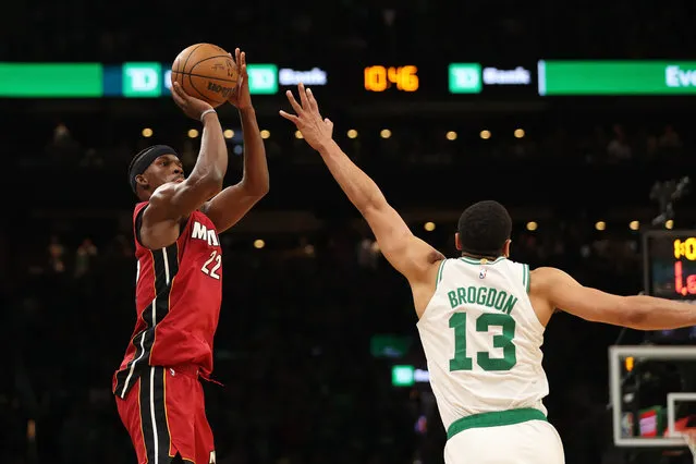Jimmy Butler #22 of the Miami Heat shoots over Malcolm Brogdon #13 of the Boston Celtics during the fourth quarter of game one of the Eastern Conference Finals at TD Garden on May 17, 2023 in Boston, Massachusetts. (Photo by Adam Glanzman/Getty Images)