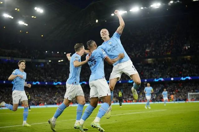Manchester City's Erling Haaland, right, and his teammates celebrate their third goal during the Champions League semifinal second leg soccer match between Manchester City and Real Madrid at Etihad stadium in Manchester, England, Wednesday, May 17, 2023. (Photo by Jon Super/AP Photo)