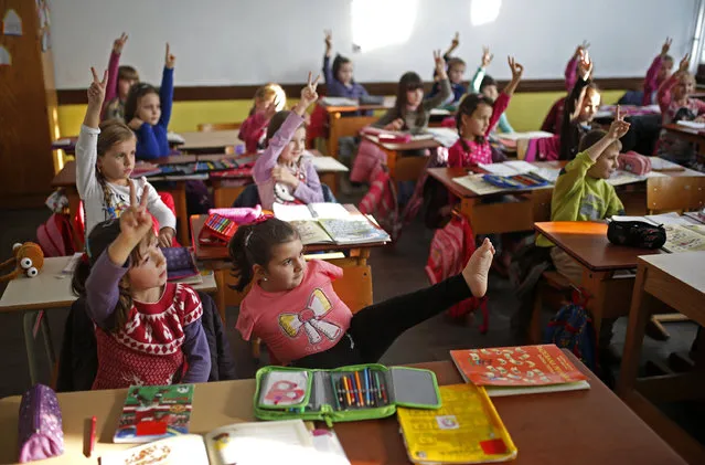 Ramela Meseljevic, a 7 year-old girl born without both of her hands and one of her legs shorter than the other, attends classes in the her school in Begov Han, Bosnia and Herzegovina December 2, 2015. (Photo by Dado Ruvic/Reuters)