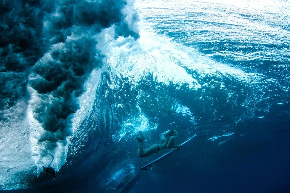 Female Surfers Beneath the Waves
