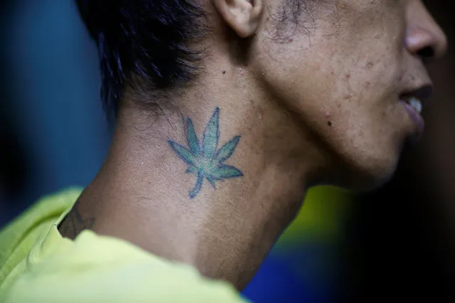 A tattoo is seen on the neck of an inmate in an underground cell of Quezon City Jail in Manila, Philippines October 19, 2016. (Photo by Damir Sagolj/Reuters)
