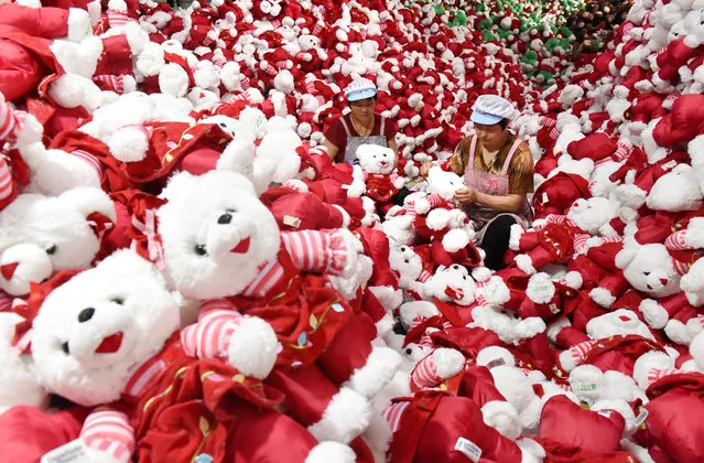 Workers make stuffed toys for export inside a factory in Linyi, Shandong province, China on June 26, 2018. (Photo by Reuters/China Stringer Network)