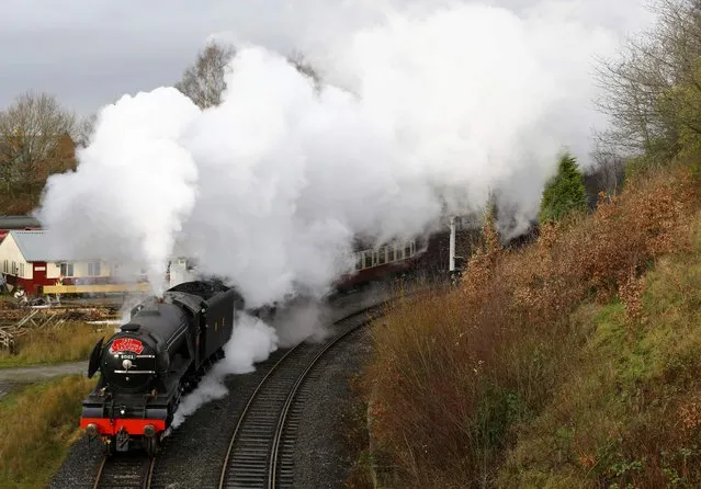 The Flying Scotsman steam engine leaves East Lancashire Railway in Bury, Britain January 8, 2016. One of the world's most famous steam engines, "Flying Scotsman," is set to return after a decade of restoration and over 80 years since it became the first locomotive to reach 100 miles an hour (160 kph). The venerable engine, which has toured both the United States and Australia since it was retired from service, made a series of short test runs on Friday, ahead of a programme of heritage journeys this year on Britain's main lines. (Photo by Darren Staples/Reuters)