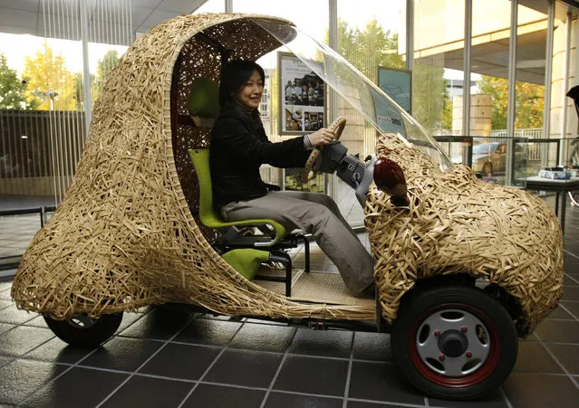 “Bamgoo”, an electric car with a body made out of bamboo, is displayed in Kyoto, western Japan November 14, 2008. The sixty-kilogram single-seater ecologically friendly concept car, which measures 270 centimeters in length, 130 centimeters in width and 165 centimeters in height, is developed by Kyoto University Venture Business Laboratory, featuring bamboo articles in the Kyoto area. The car can run for 50 kilometers on a single charge. (Photo by Issei Kato/Reuters)