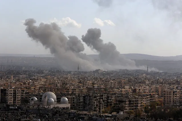A general view shows rising smoke after strikes on Aleppo city, Syria December 3, 2016. (Photo by Omar Sanadiki/Reuters)