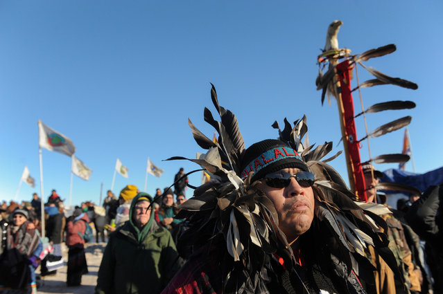 A man from the Stolo tribe in Canada stands in Oceti Sakowin camp as “water protectors” continue to demonstrate against plans to pass the Dakota Access pipeline near the Standing Rock Indian Reservation, near Cannon Ball, North Dakota, U.S. December 4, 2016. (Photo by Stephanie Keith/Reuters)