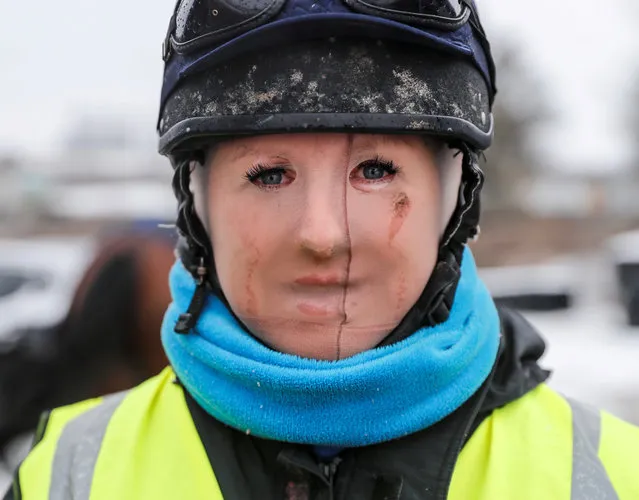 Trainer Lawney Hill poses for a photograph as she wears tights over her face to keep out the cold after taking her horses out on the all-weather gallops in Tetsworth, Britain, March 2, 2018. (Photo by Eddie Keogh/Reuters)
