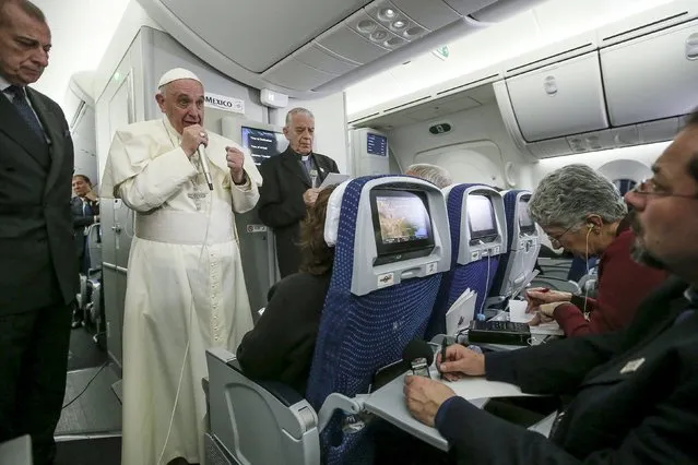 Pope Francis gestures during a meeting with the media onboard the papal plane while en route to Rome, Italy February 17, 2016. Picture taken February 17, 2016. (Photo by Alessandro Di Meo/Reuters)