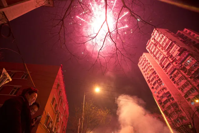 Residents set off fireworks on the eve of Lunar New Year in Beijing, China, Friday, January 27, 2017. (Photo by Ng Han Guan/AP Photo)