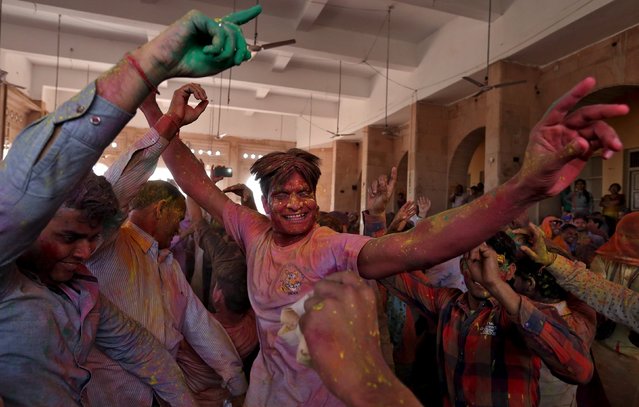 Hindu devotees take part in the religious festival of Holi, also known as the festival of colours, in the town of Barsana in the Uttar Pradesh region of India, March 16, 2016. (Photo by Cathal McNaughton/Reuters)