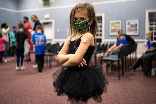 Kyla Drumm, 5, waits after receiving the Pfizer-BioNTech coronavirus disease (COVID-19) vaccine in Skippack, Pennsylvania, U.S., November 3, 2021. (Photo by Hannah Beier/Reuters)