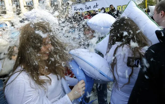 Romanian young people fight with pillows during the International Pillow Fight Day in Bucharest, Romania, 02 April 2016. (Photo by Robert Ghement/EPA)