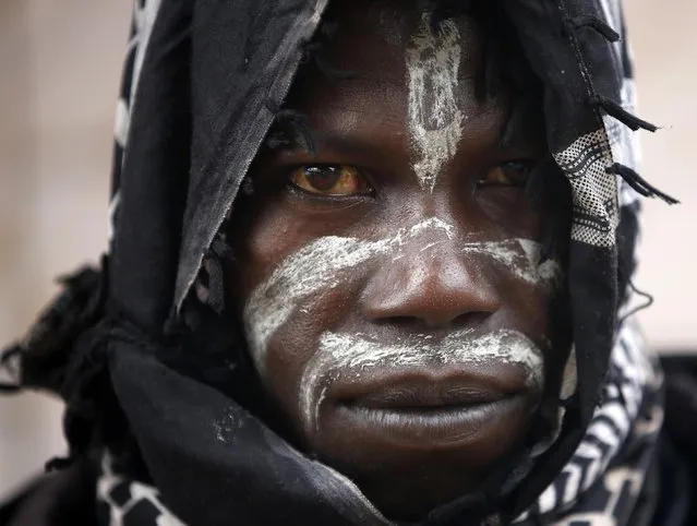 A member of the anti-balaka, a Christian militia, looks on in the village of Zawa April 8, 2014. (Photo by Goran Tomasevic/Reuters)