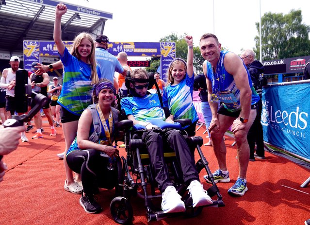 Rob Burrow alongside wife Lindsey (who ran the half marathon), daughters Macy and Maya and Kevin Sinfield who ran the full marathon all pose for a picture after the Rob Burrow Leeds Marathon, UK on Sunday, May 12, 2024. (Photo by Danny Lawson/PA Images via Getty Images)
