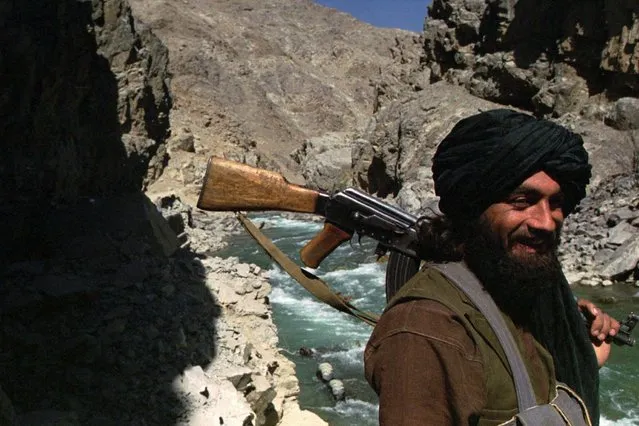 In this October 8, 1996 file photo, a Taliban soldier patrols the entrance to the Panjshir Valley, north of Kabul. In August 2021, the last remnants of Afghanistan’s shattered security forces have vowed to resist the Taliban in the remote Panjshir Valley north of Kabul, that has defied conquerors before. Under the leadership of late charismatic guerrilla fighter Ahmad Shah Massoud, fighters in the Panjshir Valley held off the Soviets in the 1980s and the Taliban a decade later. Any attempt to re-enact his exploits appears likely to fail, posing little threat to the country's new Taliban rulers.. (Photo by John Moore/AP Photo/File)