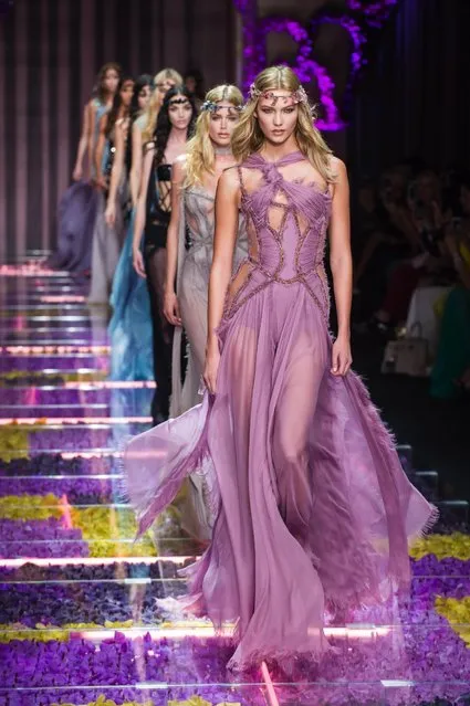 Models wear creations for Italian fashion designer Donatella Versace's fall-winter 2015/2016 Haute Couture fashion collection presented in Paris, France, Sunday, July 5, 2015. (Photo by Kamil Zihnioglu/AP Photo)