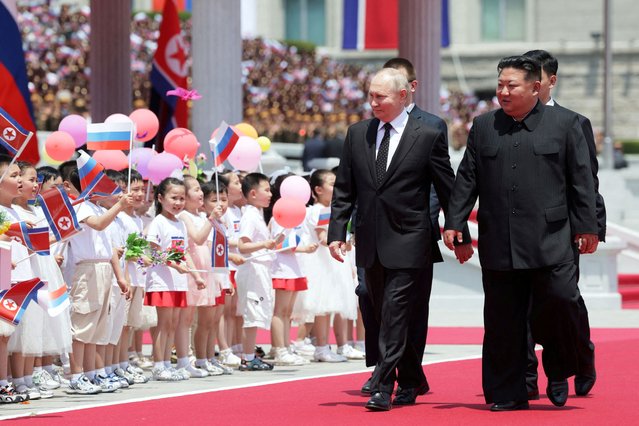 Russia's President Vladimir Putin and North Korea's leader Kim Jong Un attend an official welcoming ceremony at Kim Il Sung Square in Pyongyang, North Korea on June 19, 2024. (Photo by Gavriil Grigorov/Sputnik/Pool via Reuters)