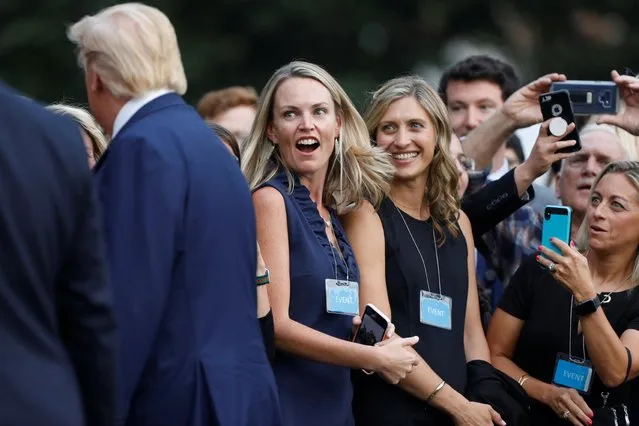 Supporters react as U.S. President Donald Trump walks from Marine One to the White House in Washington, U.S., October 3, 2019. (Photo by Tom Brenner/Reuters)
