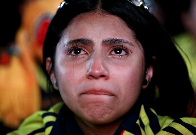 A Colombia fan looks dejected after Argentina's Lautaro Martinez scores their first goal against Colombia in the Copa America 2024 final, while watching from Bogota, Colombia on July 18, 2024. (Photo by Luisa Gonzalez/Reuters)