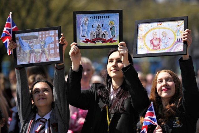 Children wait for the arrival of King Charles III and Camilla, the Queen Consort to visit Liverpool Central Library, and to officially mark the Library's twinning with Ukraine's first public Library, the Regional Scientific Library in Odesa, in Liverpool, Wednesday, April 26, 2023. King Charles III and Camilla, the Queen Consort meet key partners involved in both a two-week cultural festival that will run alongside the contest, and Eurolearn, a Eurovision-inspired education programme for primary and secondary pupils.(Photo by Jon Super/Pool via AP Photo)