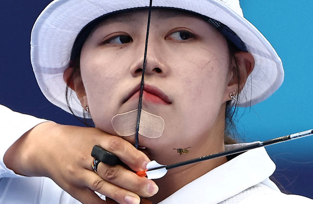 South Korea's Lim Sihyeon competes during the archery women's individual elimination round during the Paris 2024 Olympic Games at the Esplanade des Invalides in Paris on August 3, 2024. (Photo by Tingshu Wang/Reuters)