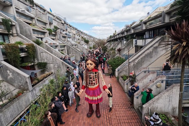 “Little Amal” is seen during a visit to learn about how Christian communities observe Easter traditions on April 02, 2023 in the Alexandra and Ainsworth Estate London, England. Little Amal, embodying a 10-year-old Syrian refugee, was created in 2021 as part of a performance art piece called “The Walk”, to raise awareness of the refugee experience. (Photo by Leon Neal/Getty Images)