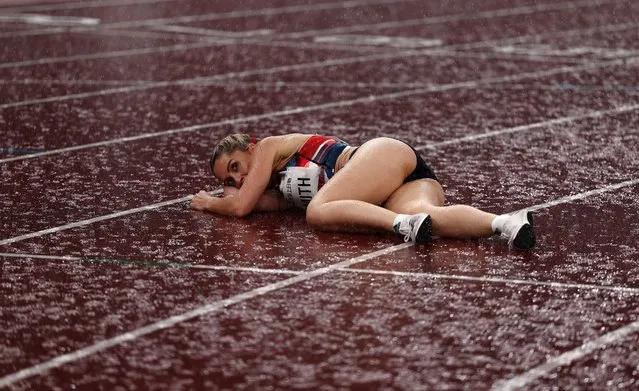 Ali Smith of Team Great Britain lies on the ground after competing in the Women's 400m - T38 Final on day 11 of the Tokyo 2020 Paralympic Games at the Olympic Stadium on September 04, 2021 in Tokyo, Japan. (Photo by Athit Perawongmetha/Reuters)