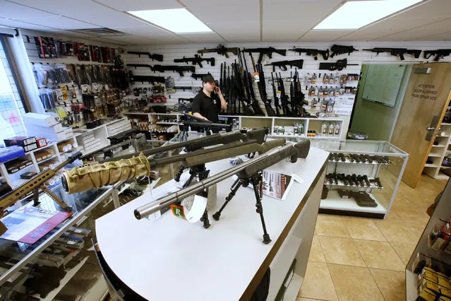 Sniper rifles sit on display for sale at the “Ready Gunner” gun store in Provo, Utah, U.S., June 21, 2016. (Photo by George Frey/Reuters)