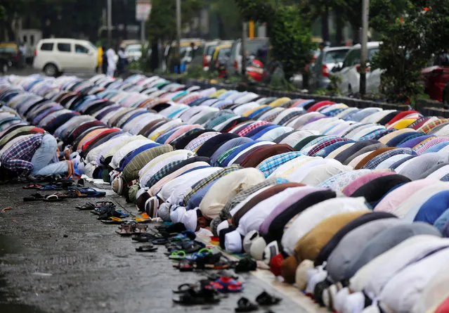 Muslims offer Friday prayers on a street outside a mosque in Mumbai, India, June 24, 2016. (Photo by Shailesh Andrade/Reuters)