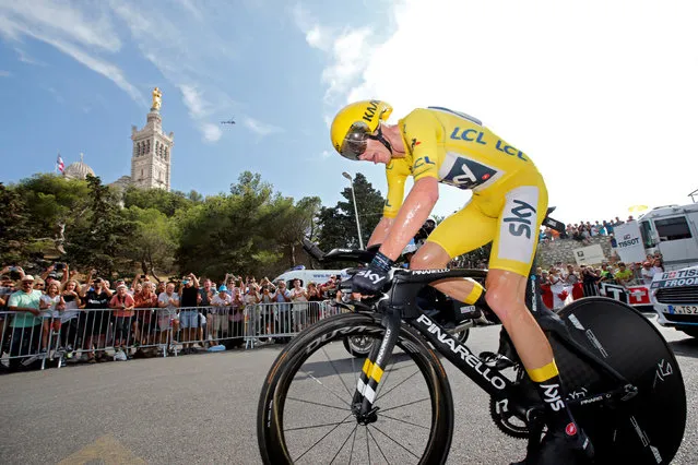 Britain' s Chris Froome, wearing the overall leader' s yellow jersey in action with the Notre Dame de la Garde basilica in the background during the twentieth stage of the Tour de France cycling race, an individual time trial over 22.5 kilometers (14 miles) with start and finish in Marseille, France, Saturday, July 22, 2017. (Photo by Jean-Paul Pelissier/Reuters)