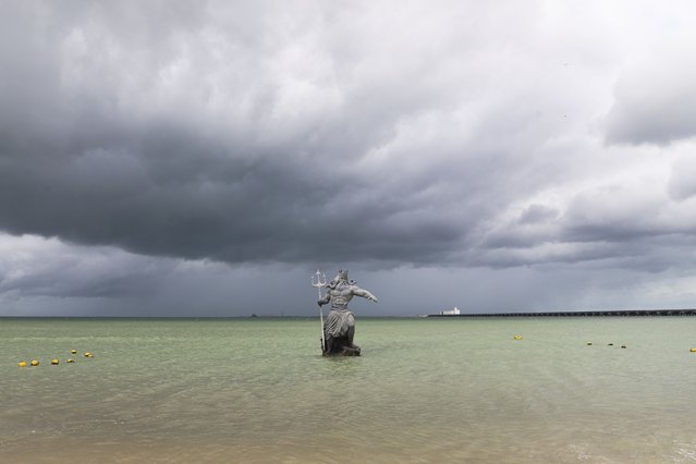 A sculpture of Poseidon stands in the ocean before the arrival of Hurricane Milton, in Progreso, Yucatan state, Mexico, Monday, October 7, 2024. (Photo by Martin Zetina/AP Photo)