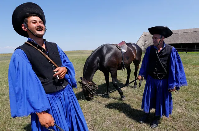 Traditional Hungarian horsemen pause for a laugh in the Great Hungarian Plain in Hortobagy, Hungary June 30, 2016. (Photo by Laszlo Balogh/Reuters)
