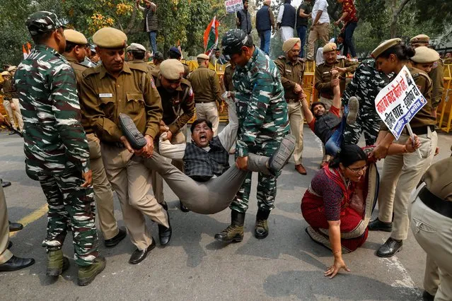 Police detains activists of the youth wing of India's main opposition Congress party during a protest demanding the resignation of Home Minister Amit Shah following last week's clashes between people demonstrating for and against a new citizenship law, in New Delhi, India on March 2, 2020. (Photo by Anushree Fadnavis/Reuters)