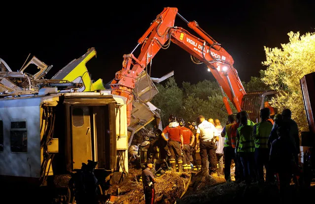 Rescuers work at the site where two passenger trains collided in the middle of an olive grove in the southern village of Corato, near Bari, Italy, July 12, 2016. (Photo by Alessandro Garofalo/Reuters)