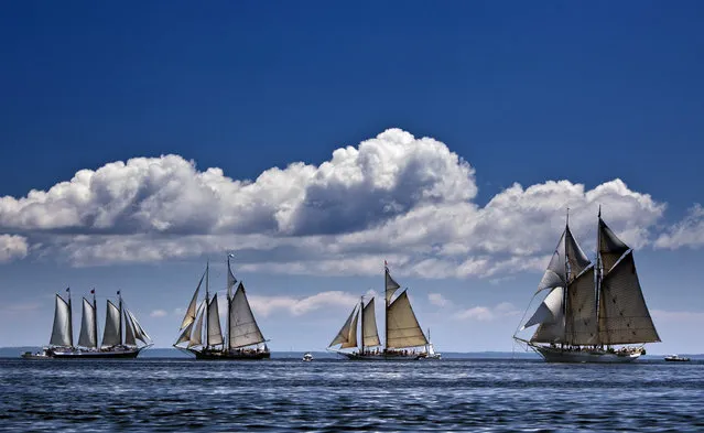 In this photo made July 6, 2012, the schooner Mary Day, right, sails in a schooner race with other members of Maine's windjammer fleet off Rockland, Maine. (Photo by Robert F. Bukaty/AP Photo)