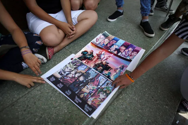 Posters are displayed for selling at the entrance of a cinema where the Cuban Otaku festival is taking place in Havana, Cuba, July 24, 2016. (Photo by Alexandre Meneghini/Reuters)