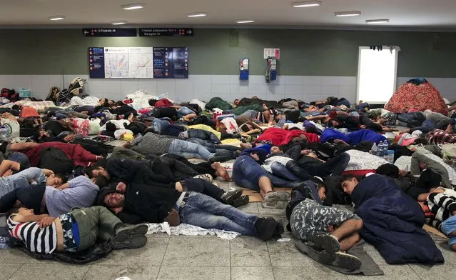 Migrants sleep near the Keleti railway station in Budapest, Hungary, September 3, 2015. (Photo by Bernadett Szabo/Reuters)