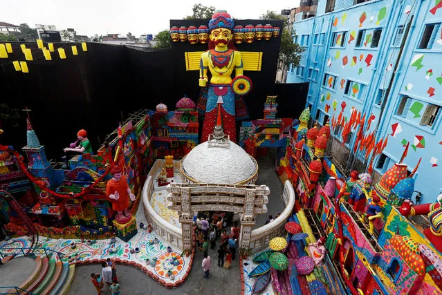 A giant sculpture of the demon king Ravana is installed at a temporary platform called pandal during the Hindu religious festival of Durga Puja in Kolkata, September 29, 2017. (Photo by Rupak De Chowdhuri/Reuters)