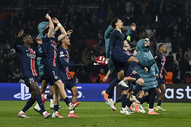 PSG's players celebrate their victory at the end of the UEFA Champions League knockout phase play-off 2nd leg football match between Paris Saint-Germain (FRA) and Brest (FRA) at the Parc des Princes stadium in Paris on February 19, 2025. (Photo by Julien de Rosa/AFP Photo)