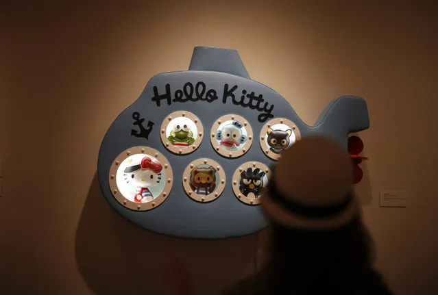 Vivian Wolfson, 10, views an exhibit at the “Hello! Exploring the Supercute World of Hello Kitty” museum exhibit in honor of Hello Kitty's 40th anniversary, at the Japanese American National Museum in Los Angeles, California October 10, 2014. (Photo by Lucy Nicholson/Reuters)