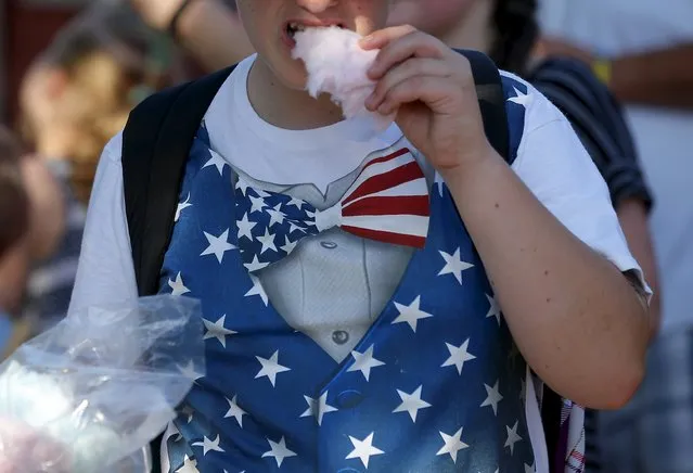 A boy eats cotton candy at the Iowa State Fair in Des Moines, Iowa, United States, August 15, 2015. (Photo by Jim Young/Reuters)