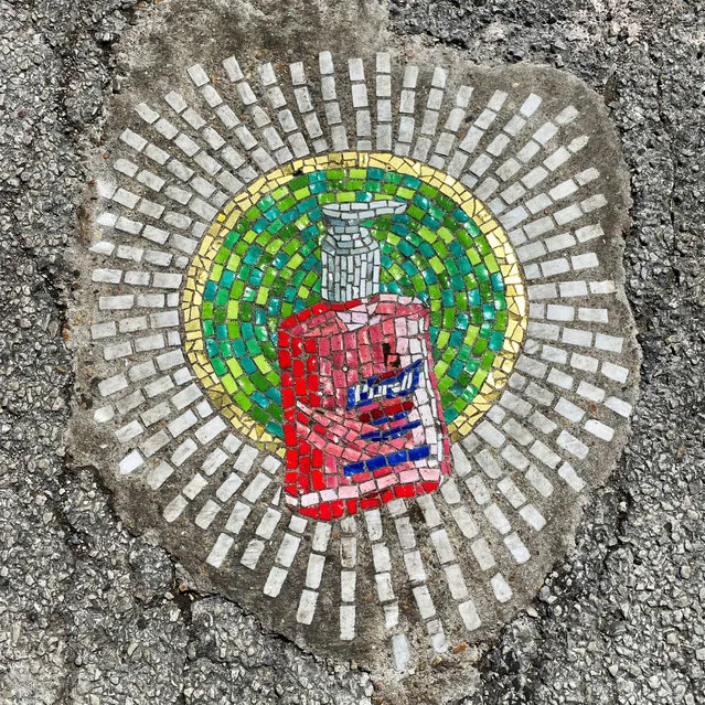 Chicago artist Jim Bachor creates four pandemic-themed pothole mosaics on the city's North Side, during the coronavirus disease (COVID-19) outbreak in Chicago, Illinois, U.S., May 20, 2020. (Photo by Brendan O'Brien/Reuters)