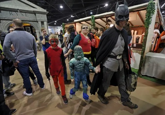 Members of a family dressed in superhero costumes attend the first edition of the HeroFestival in Marseille, November 9, 2014. (Photo by Jean-Paul Pelissier/Reuters)