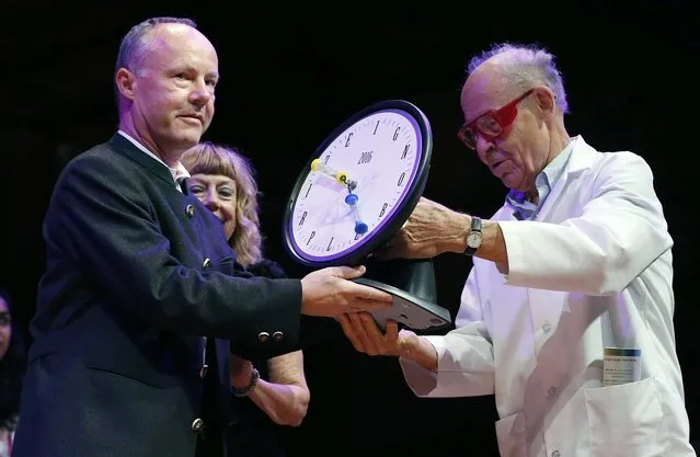 Fredrik Sjoberg, left, of Sweden, accepts the Ig Nobel award in literature from Nobel laureate Dudley Herschbach (chemistry, 1986) during ceremonies at Harvard University in Cambridge, Mass., Thursday, September 22, 2016. Sjoberg's research led him to publish three volumes about collecting hoverflies on the sparsely populated Swedish island where he lives. His books are a hit in his homeland and the first volume's English translation, “The Fly Trap”, has earned rave reviews. (Photo by Michael Dwyer/AP Photo)