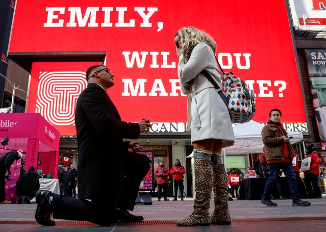 Joe lodato proposes to Emily Gambarella on Valentine's Day in Times Square in New York, U.S., February 14, 2018. (Photo by Brendan McDermid/Reuters)