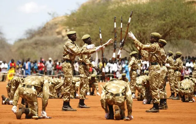 Kenya Wildlife Services (KWS) rangers perform a silent drill during the passing out parade for 592 rangers at the Law Enforcement Academy Manyani in Tsavo West National Park, October 27, 2015. Kenya Wildlife Services Law Enforcement Academy conducts training programs for uniformed personnel including general security courses for staff from institutions outside the wildlife conservation fraternity especially to combat poaching, KWS officials said. (Photo by Thomas Mukoya/Reuters)