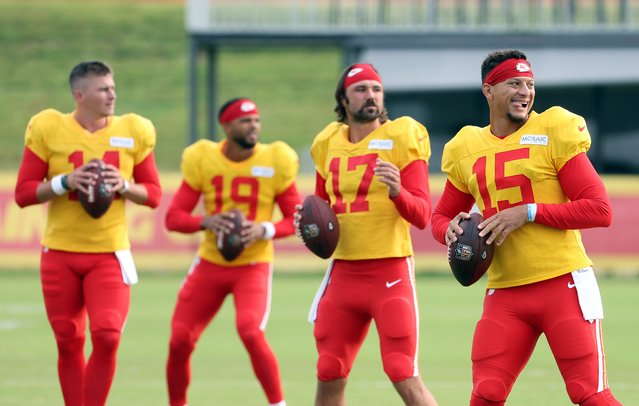 Quarterbacks Patrick Mahomes #15, Gardner Minshew #17, Chris Oladokun #19 and Bailey Zappe #14 execute a passing drill during Kansas City Chiefs Training Camp at Missouri Western State University on August 06, 2025 in St Joseph, Missouri. (Photo by Jamie Squire/Getty Images)