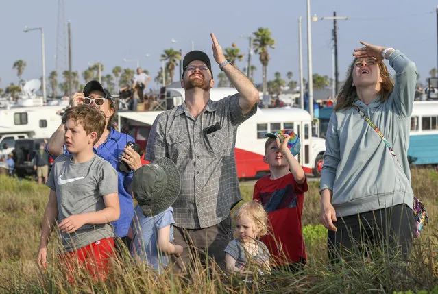 Ross Inman (center) along with his wife, Janel, along with their four kids Levi, Judah, Gabriel and Beatrix and grandmother Sharla McMichael (far left) watch the SpaceX's Starship spacecraft and Super Heavy rocket explode after launch from Starbase on April 20, 2023. (Photo by Jonathan Newton/The Washington Post)
